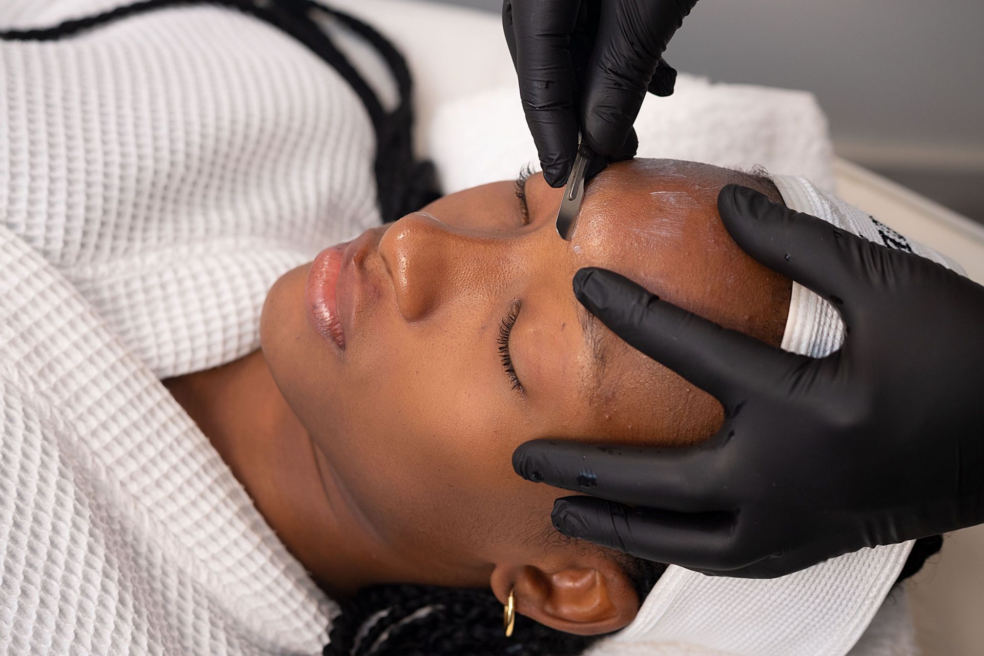 A relaxing facial treatment for a young woman at a spa in Federal Capital Territory, Nigeria.